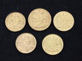 A 1910 gold sovereign and four