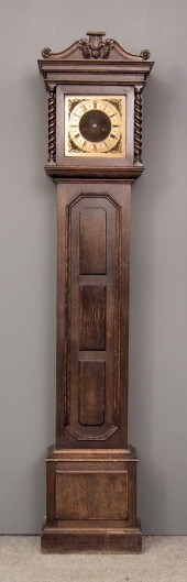 A 1920s dark oak longcase cloc