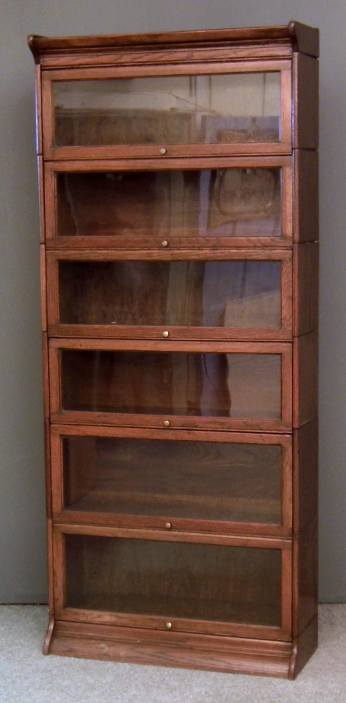 A 1920s oak six tier sectional