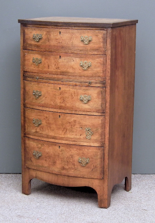 A 1920s walnut bow-front chest of