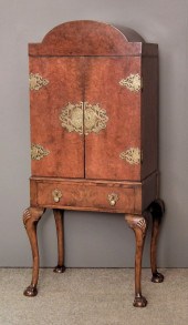 A 1930s figured walnut and bra
