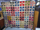 A 19TH C. PATCHWORK BEAR'S PAW
