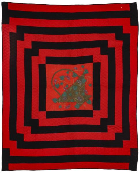 A 19TH C. RED AND BLACK QUILT