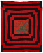 A 19TH C. RED AND BLACK QUILT