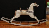 A 19TH CENTURY CARVED AND PAIN