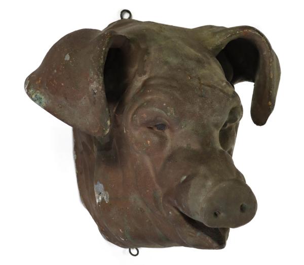 A 19TH CENTURY MOLDED ZINC PIG HEAD