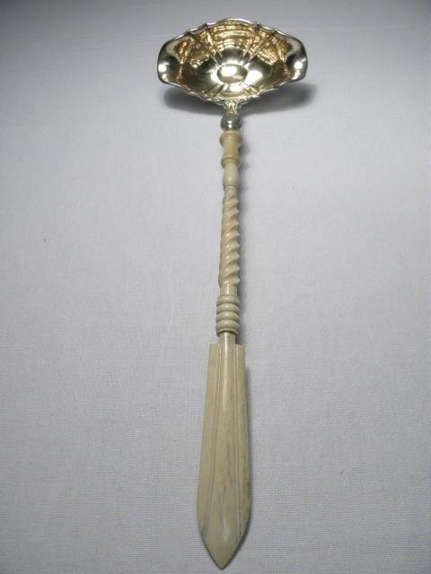 A 19th century punch ladle with a