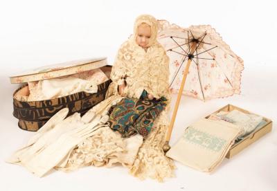A 19th Century wax doll, a box of