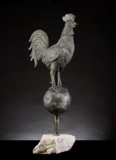 A 19TH CENTURY ZINC ROOSTER ON
