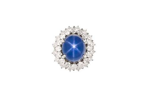 A 22 CARAT STAR SAPPHIRE, DIAMOND &