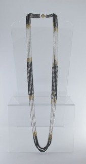 A 38'' BEAD NECKLACE OF 14K GO