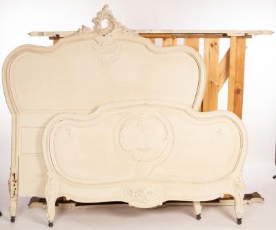 A 4'6'' white painted bedstead with