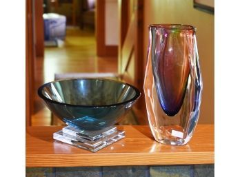 A 4"H x 8"dia. blue glass bowl