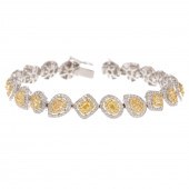 A 7.50 CTW YELLOW & WHITE DIAM