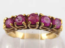 A 9 carat gold five stone garnet