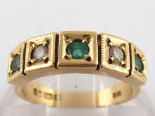 A 9 carat gold five stone emerald