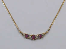 A 9 carat gold necklace set with