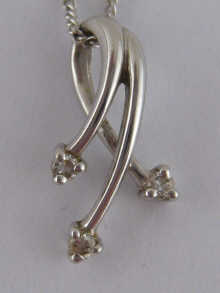 A 9 carat white gold pendant and