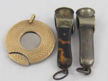 A 9 ct. gold cased disc cigar