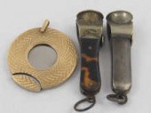 A 9 ct. gold cased disc cigar