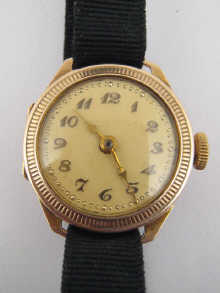 A 9 ct gold lady's wrist watch on a