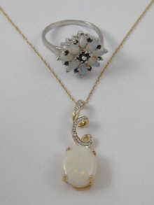 A 9 ct gold opal ring and a