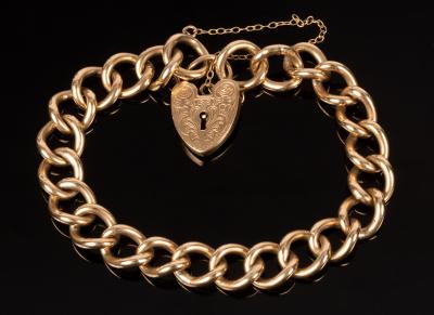 A 9ct gold curb link bracelet, S