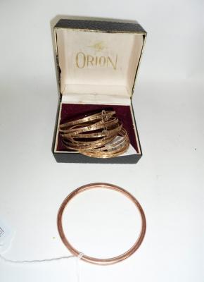A 9ct rose gold bangle of plain