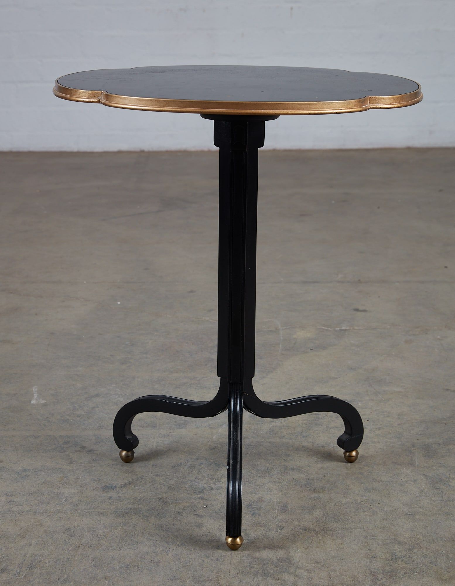 A BAKER EBONIZED AND GILT