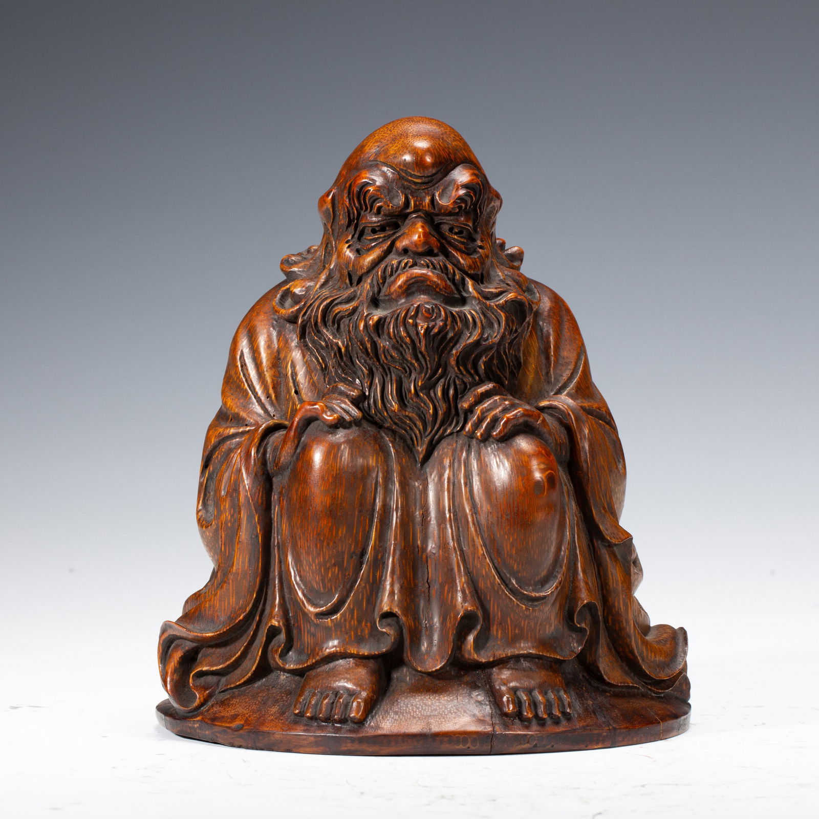 A BAMBOO - CARVED STATUE OF