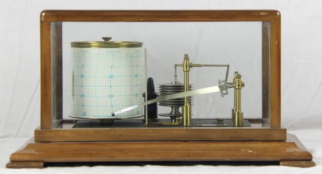 A barograph in a glazed mahogany