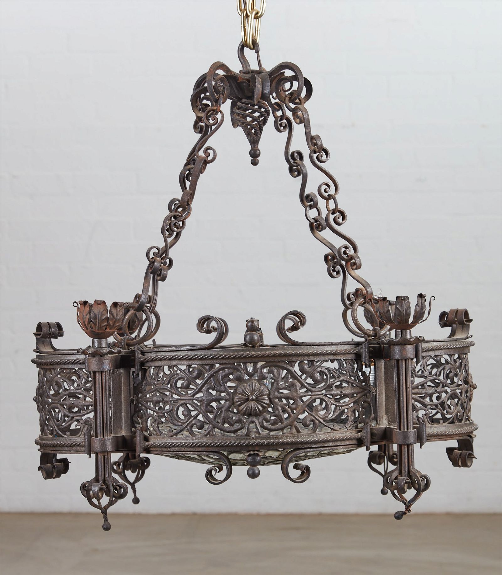 A BAROQUE STYLE IRON AND GLASS