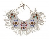 A BEADED HIDE DRESS YOKEA bead