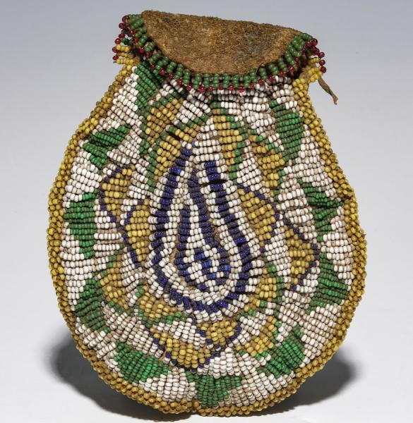 A BEADED HIDE POUCH, POSSIBLY
