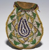A BEADED HIDE POUCH, POSSIBLY