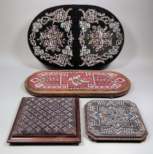 A beadwork oval cushion on black