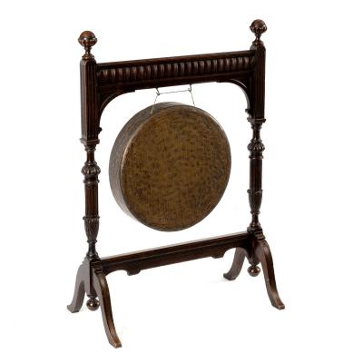 A beaten brass gong on reeded