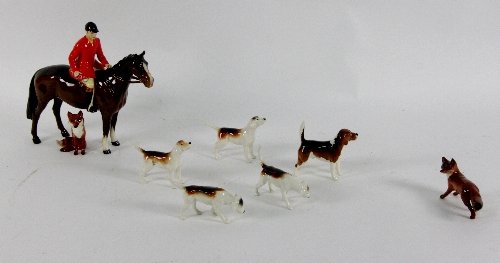 A Beswick figure of a huntsman on a