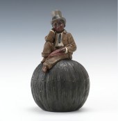 A Black Americana Figural Toba