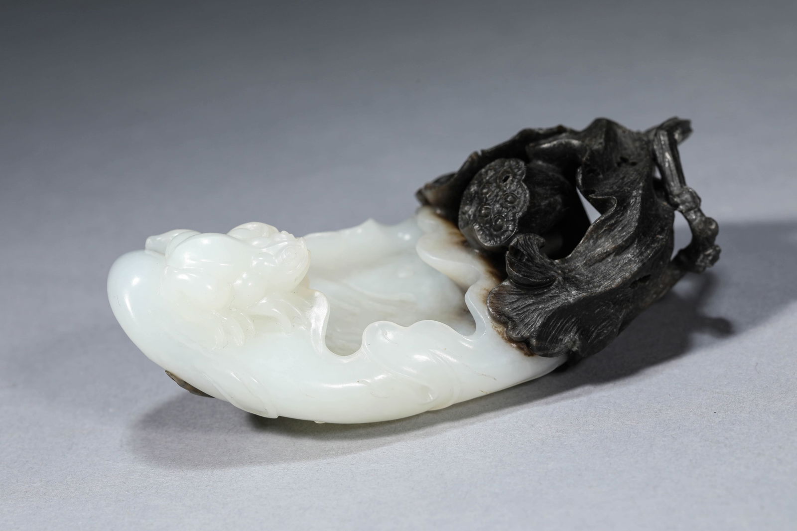 A BLACK AND WHITE JADE CARVED