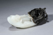 A BLACK AND WHITE JADE CARVED