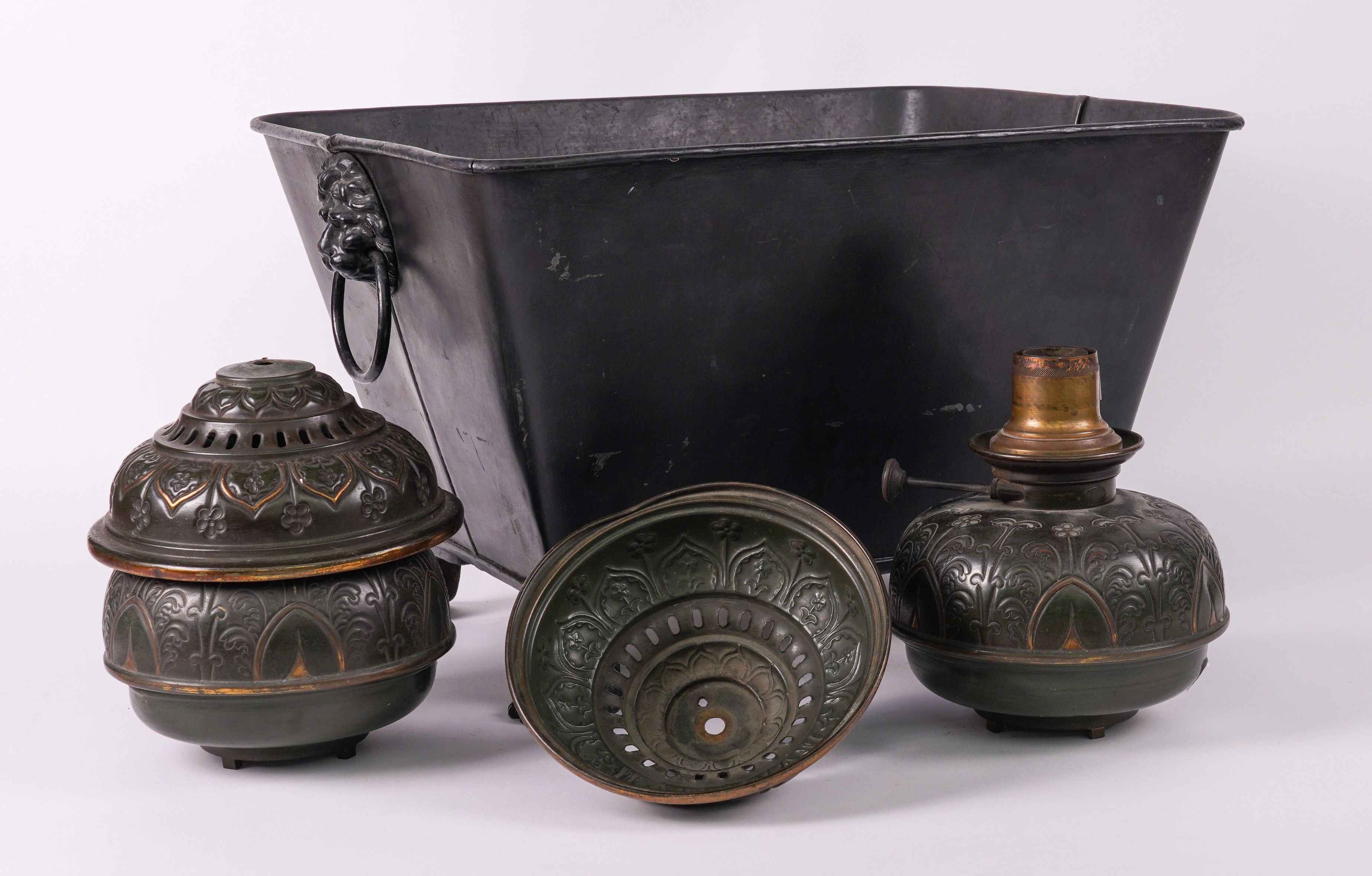 A BLACK CAST-IRON SARCOPHAGUS