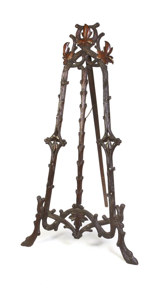 A Black Forest Carved Easel of