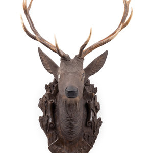 A Black Forest Carved Stag Head