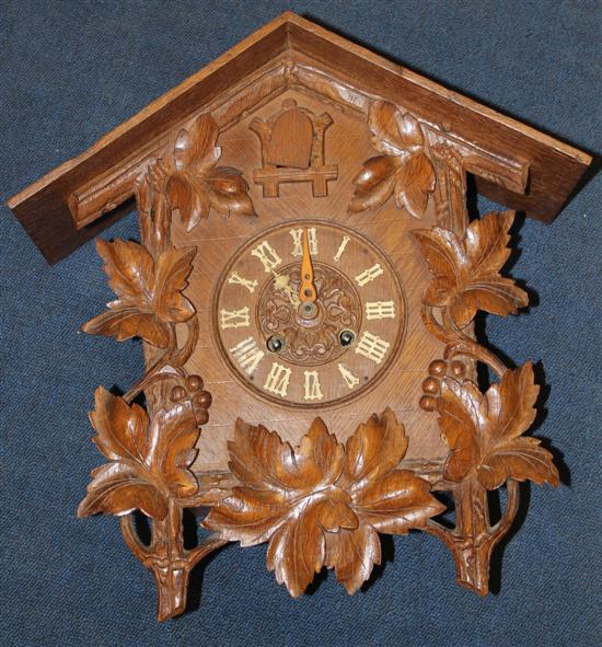 A Black Forest carved wood cuckoo