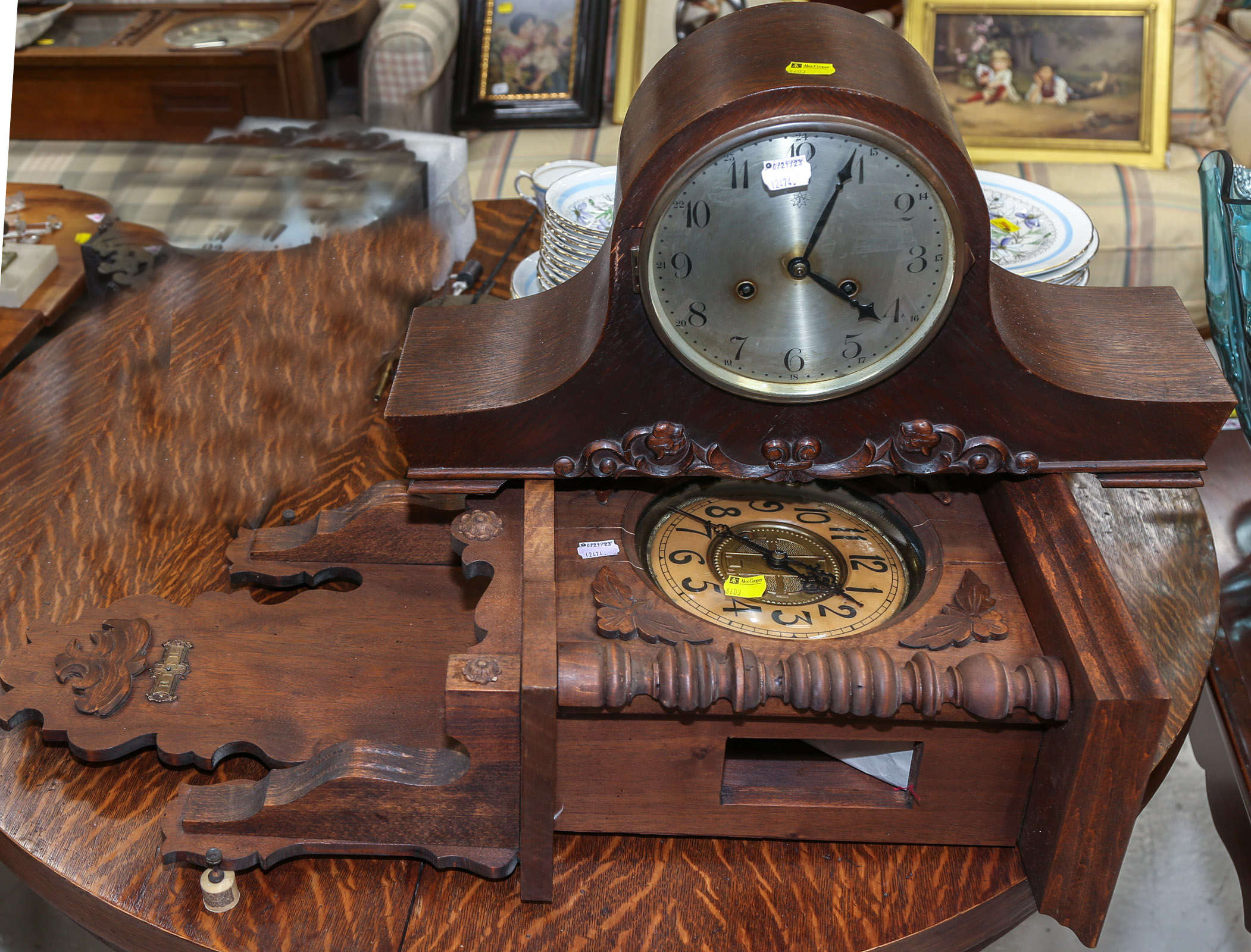 A BLACK FOREST STYLE WALL CLOCK &