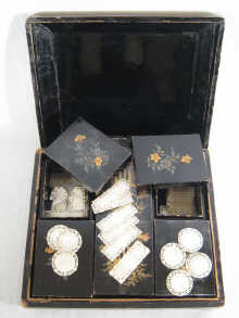 A black lacquered case with five