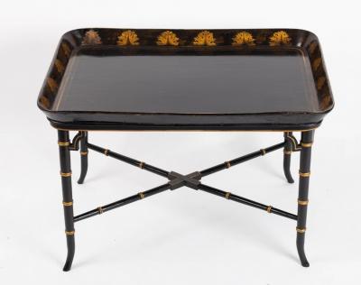A black lacquered tray mounted on a