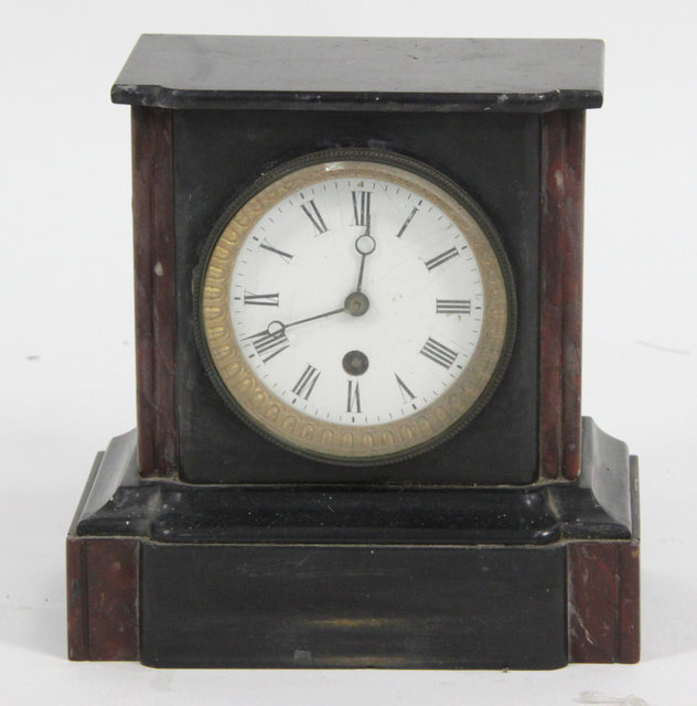 A black marble mantel clock