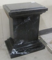 A BLACK MARQUINA MARBLE PEDEST